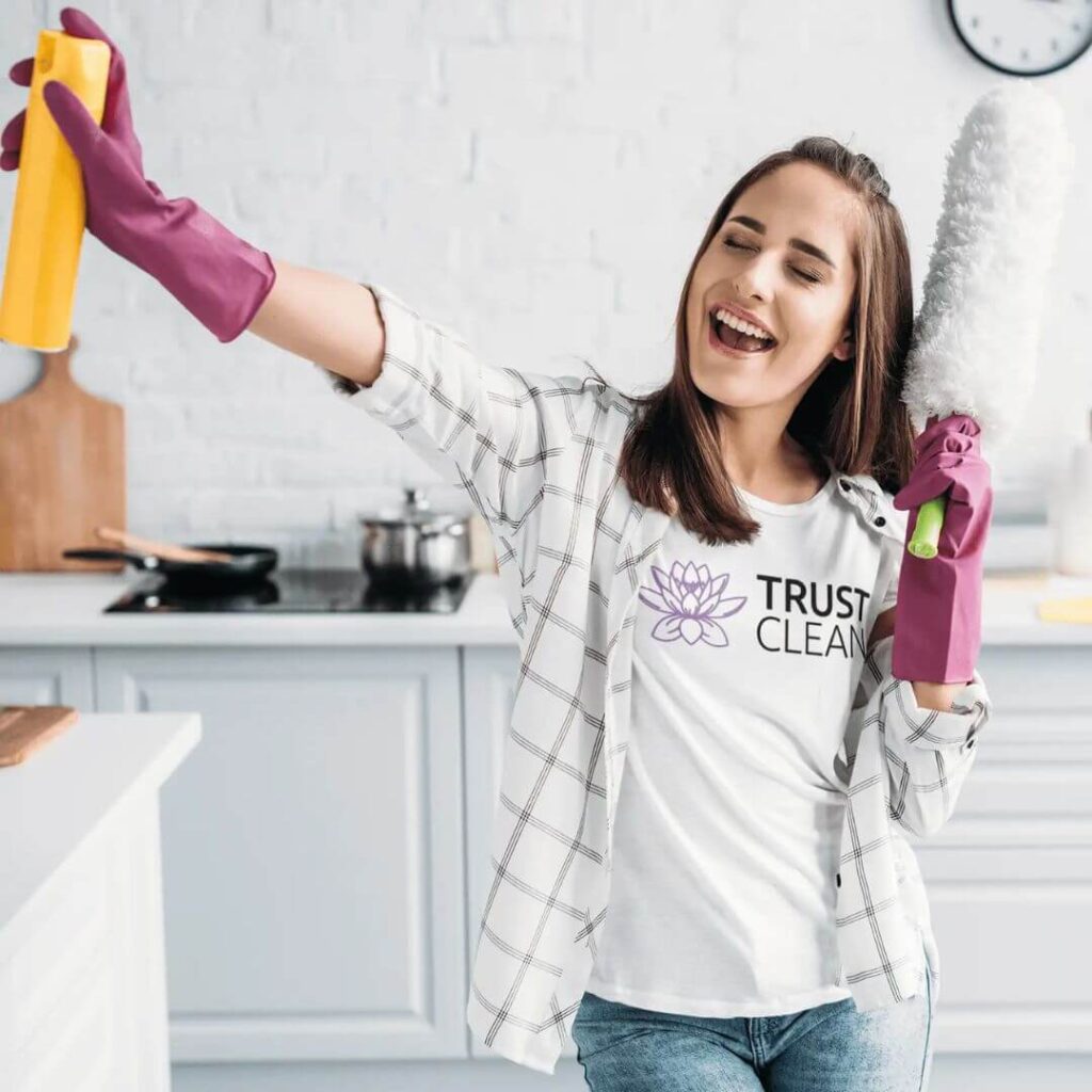 A girl happily holding cleaning product