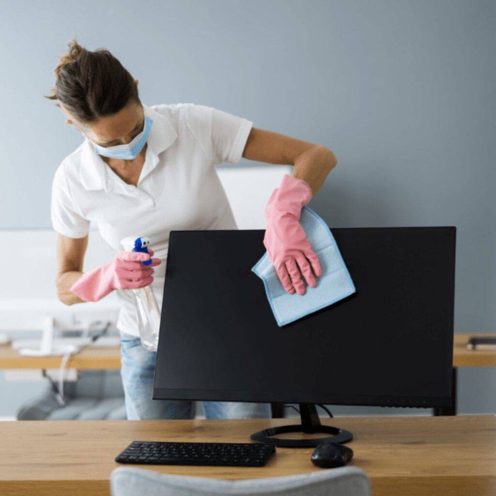 A girl cleaning laptop
